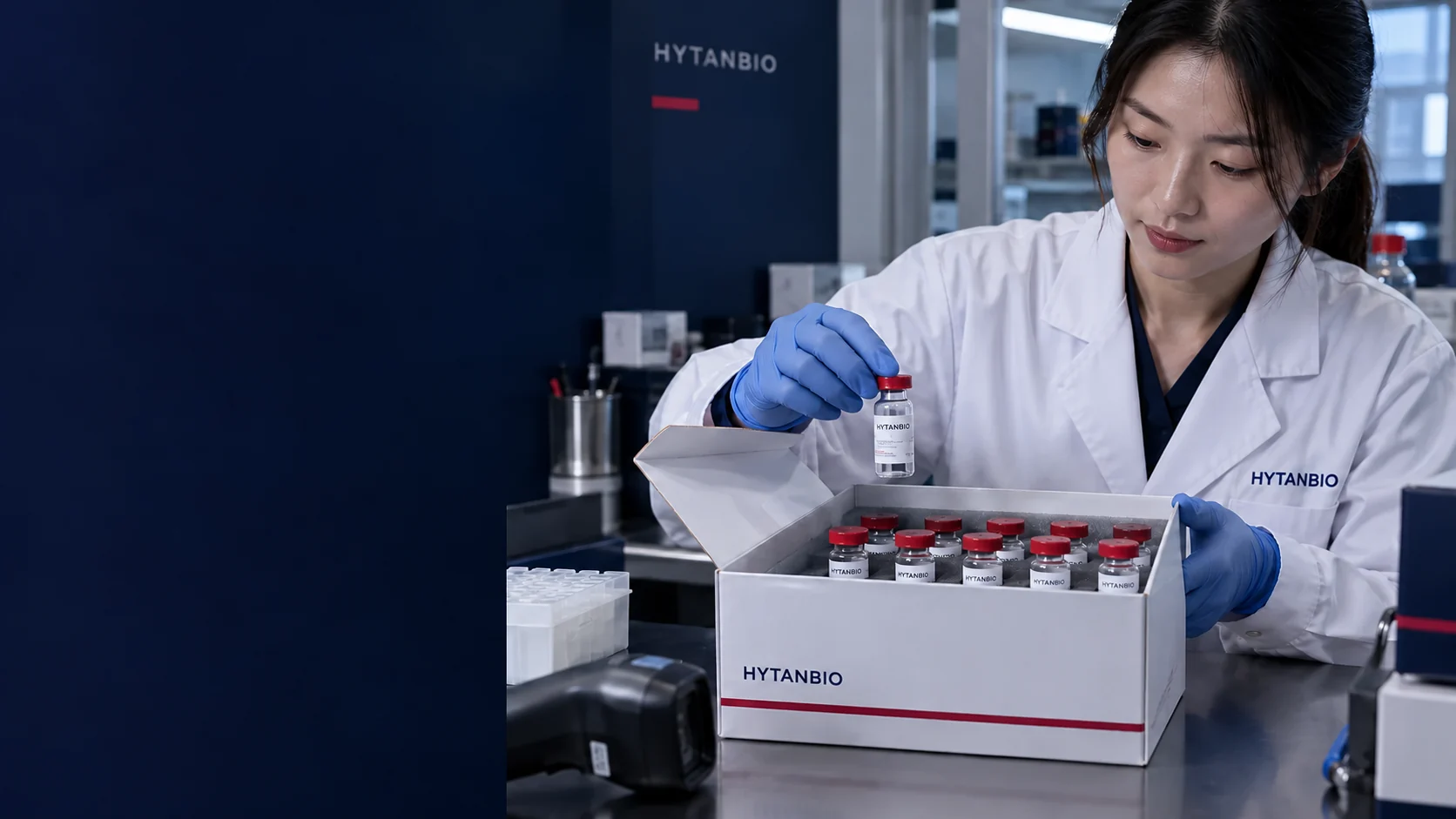 A sealed research sample box on a laboratory receiving desk, no patient, drug instruction or administration device — illustrative development scene