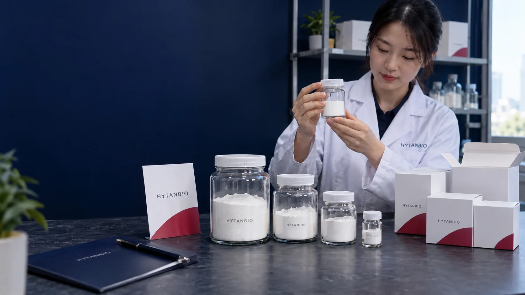 A row of straight sealed wide-neck glass intermediate jars of different sizes next to empty white shipping cartons and a berry-edged packaging card on a slate table; vertical camera lines — illustrative development scene