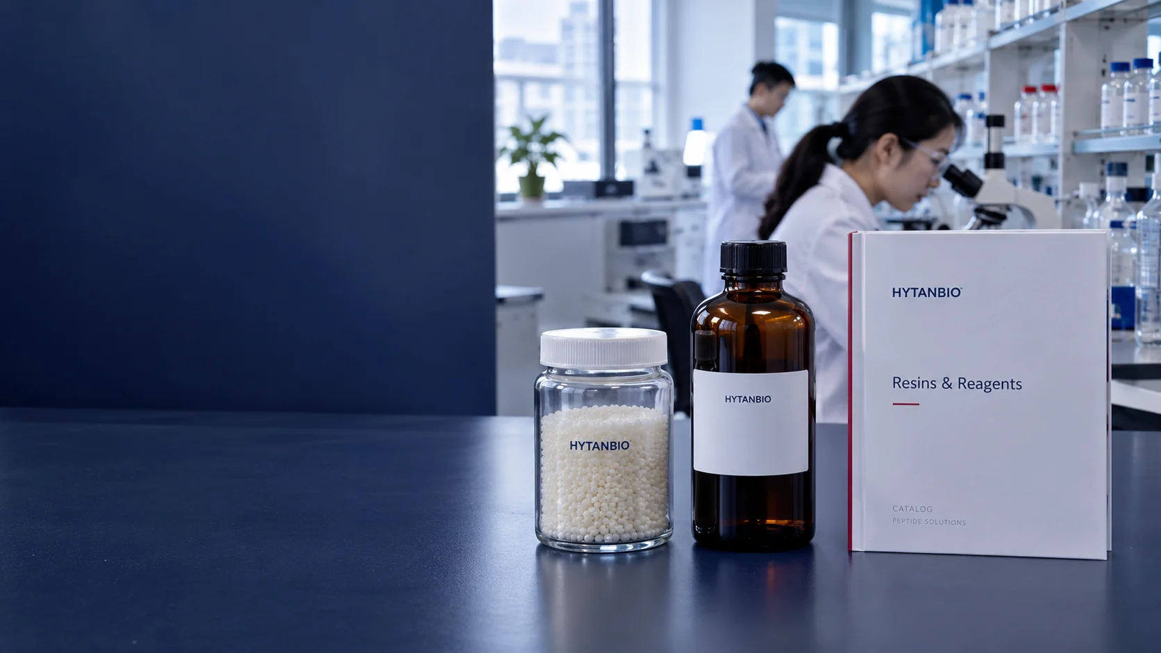 Straight clear jar containing pale dry resin beads, a tall sealed amber reagent bottle and a plain laboratory catalog folder on a navy matte bench; cool daylight from a high laboratory window — illustrative development scene