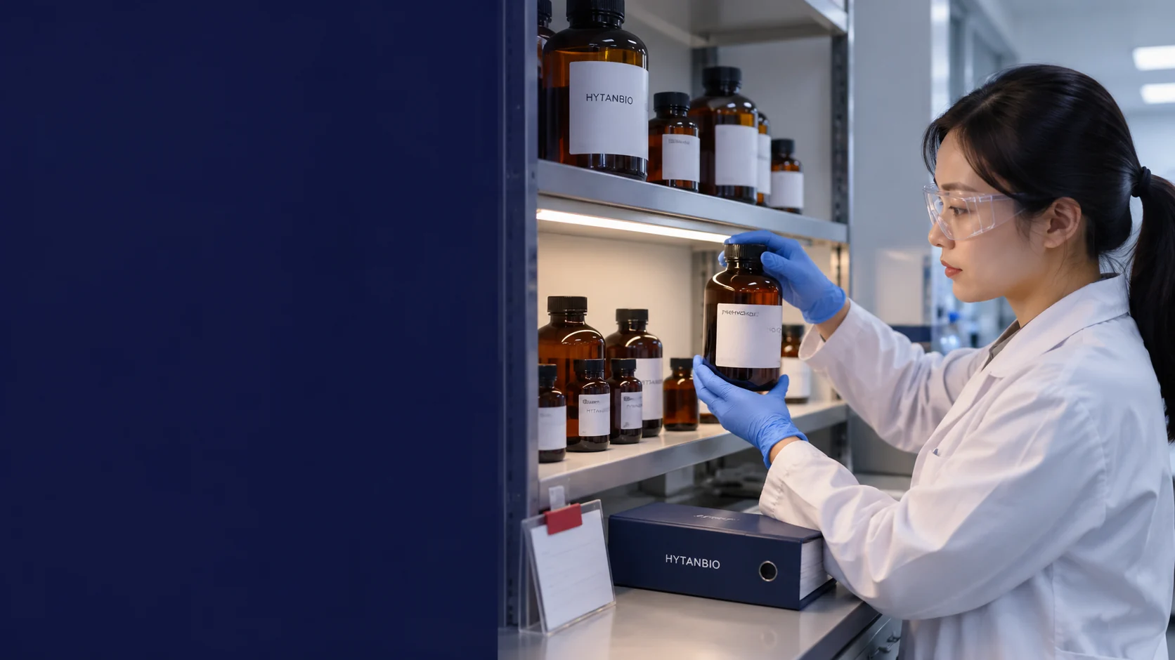 A laboratory storage shelf with differently sized upright capped amber reagent bottles and a closed navy record folder; practical under-shelf lighting, berry tab on a blank inventory card — illustrative development scene