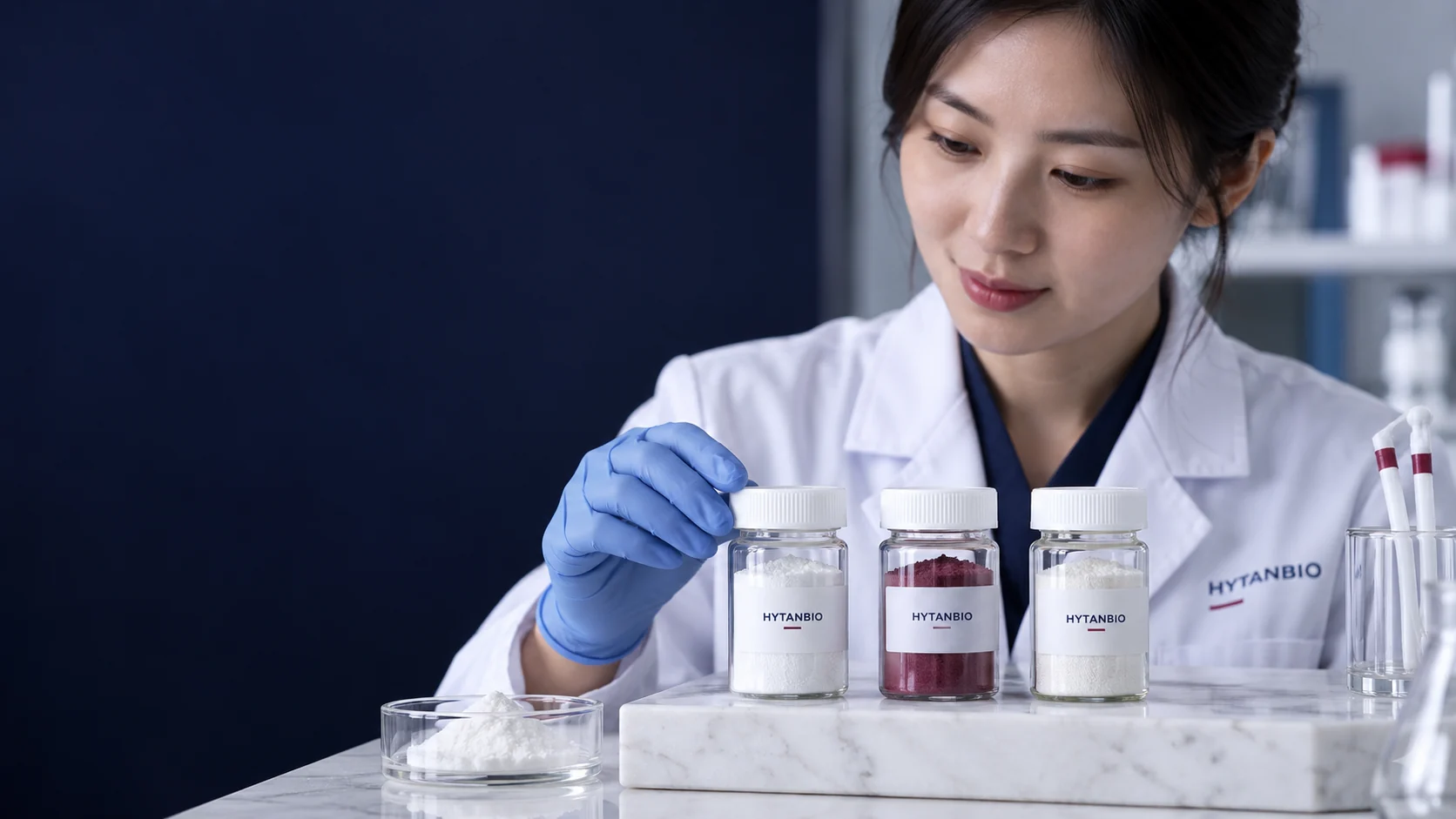 Three distinct small capped raw material containers with blank identity cards on white stone — illustrative development scene