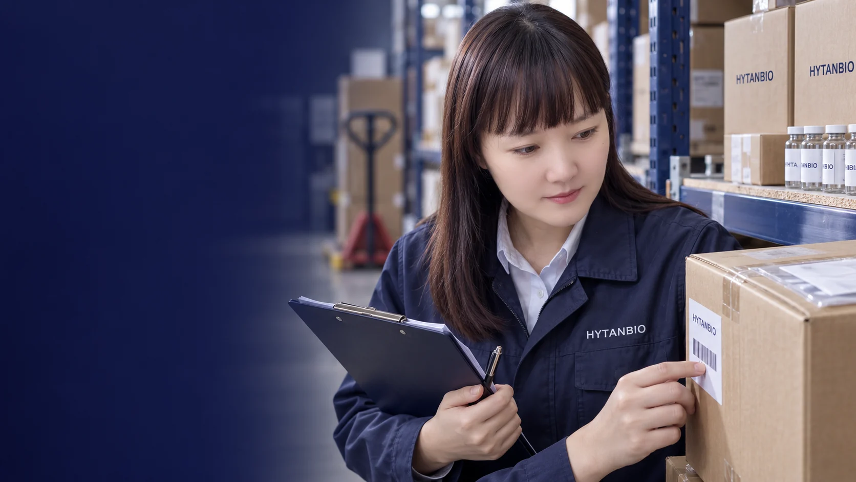 An East Asian warehouse colleague checks a label on a sealed carton beside a document sleeve — illustrative development scene