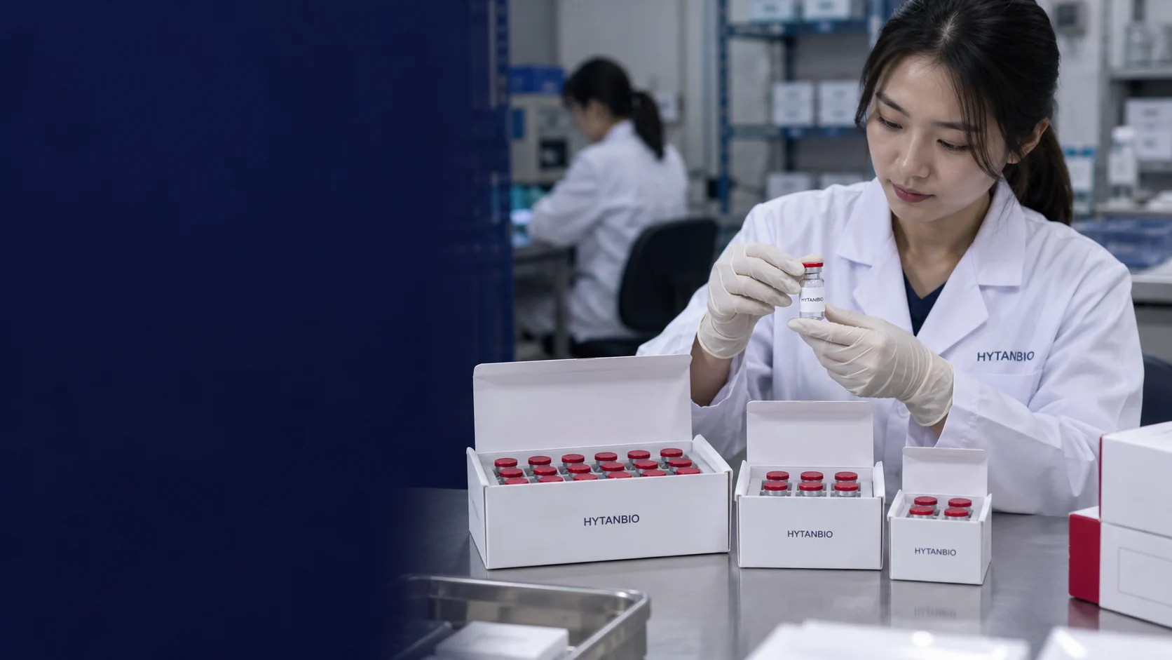 Three differently sized white vial cartons with protective inserts on a clean packing table — illustrative development scene