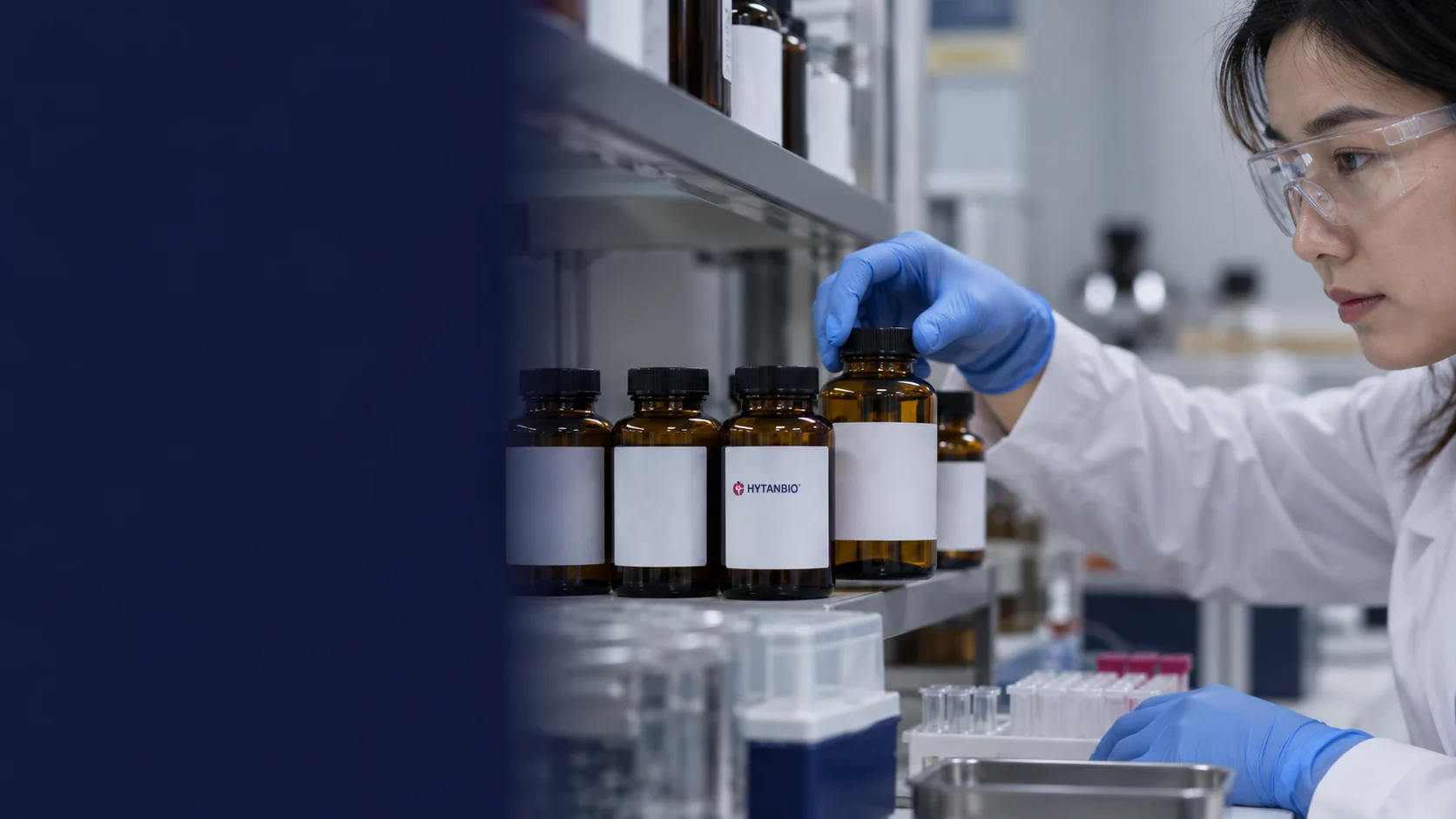 Upright small amber raw material bottles with neutral identity labels on a clean laboratory shelf — illustrative development scene