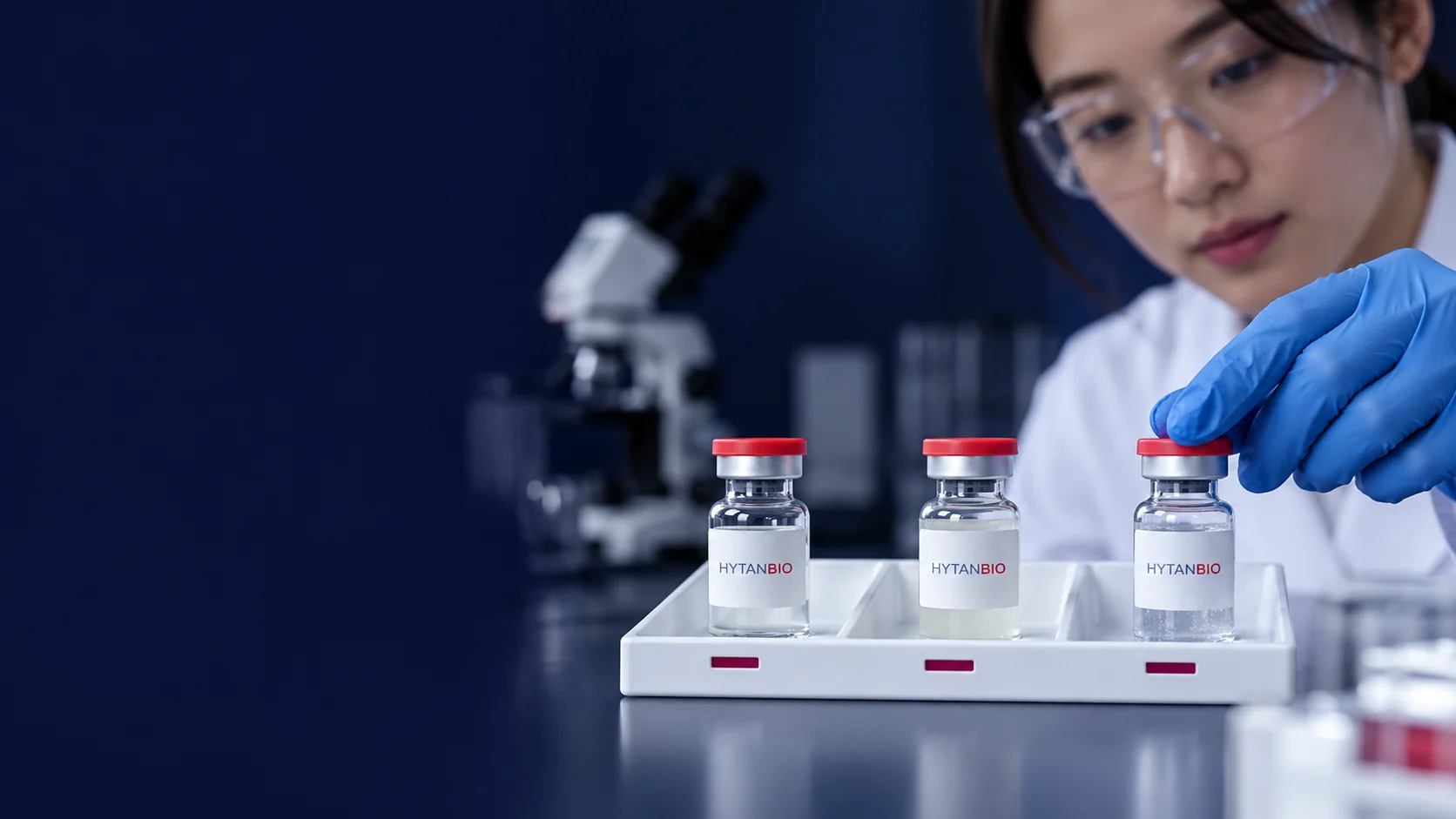 Three separate sample vials in individual labelled positions within a white tray — illustrative development scene