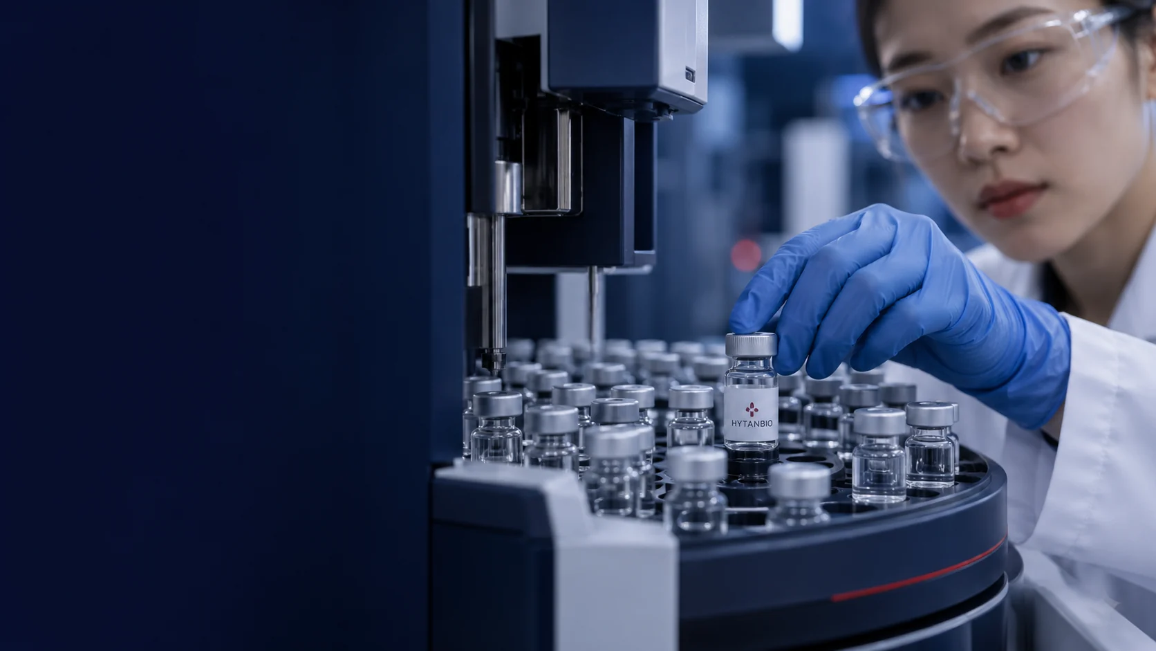 A macro view of clear capped sample vials in a precision autosampler tray — illustrative development scene